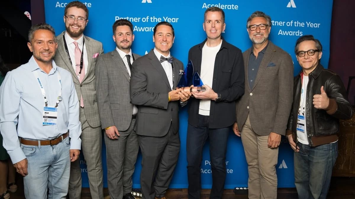 Atlas Bench accepting the 2026 Atlassian Partner of the Year Rising Star award for the Americas at Partner Accelerate
