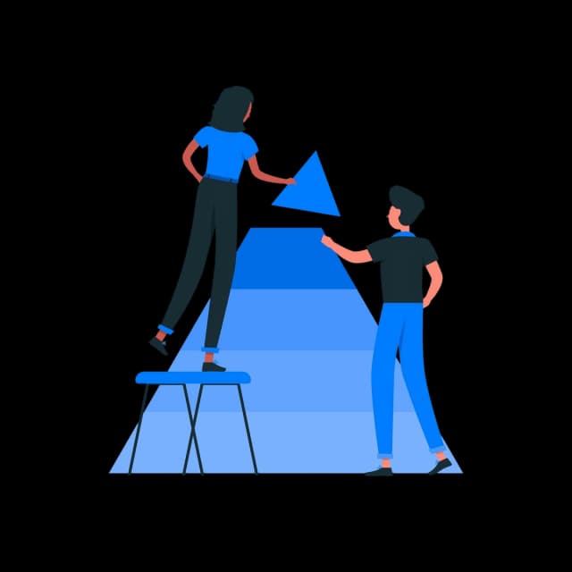 Two people working together to place a triangular piece onto a structured diagram.