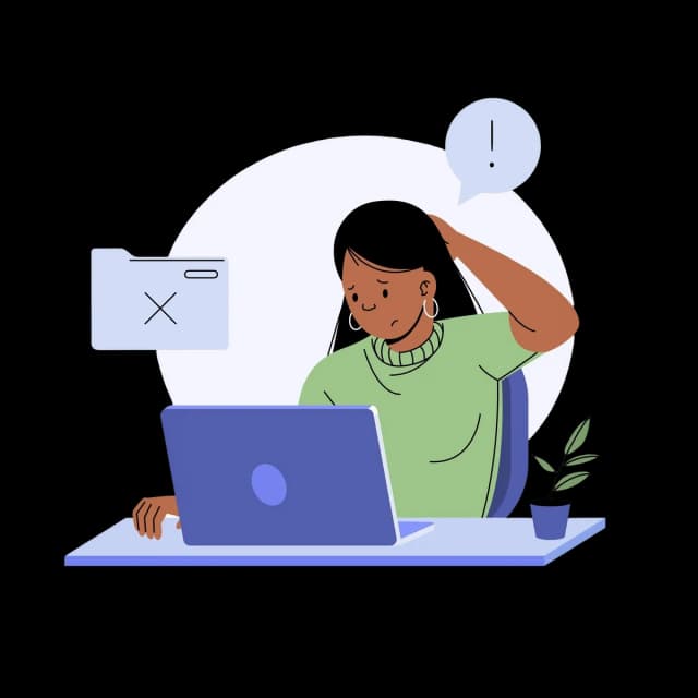 Person experiencing a software error while working on a laptop.