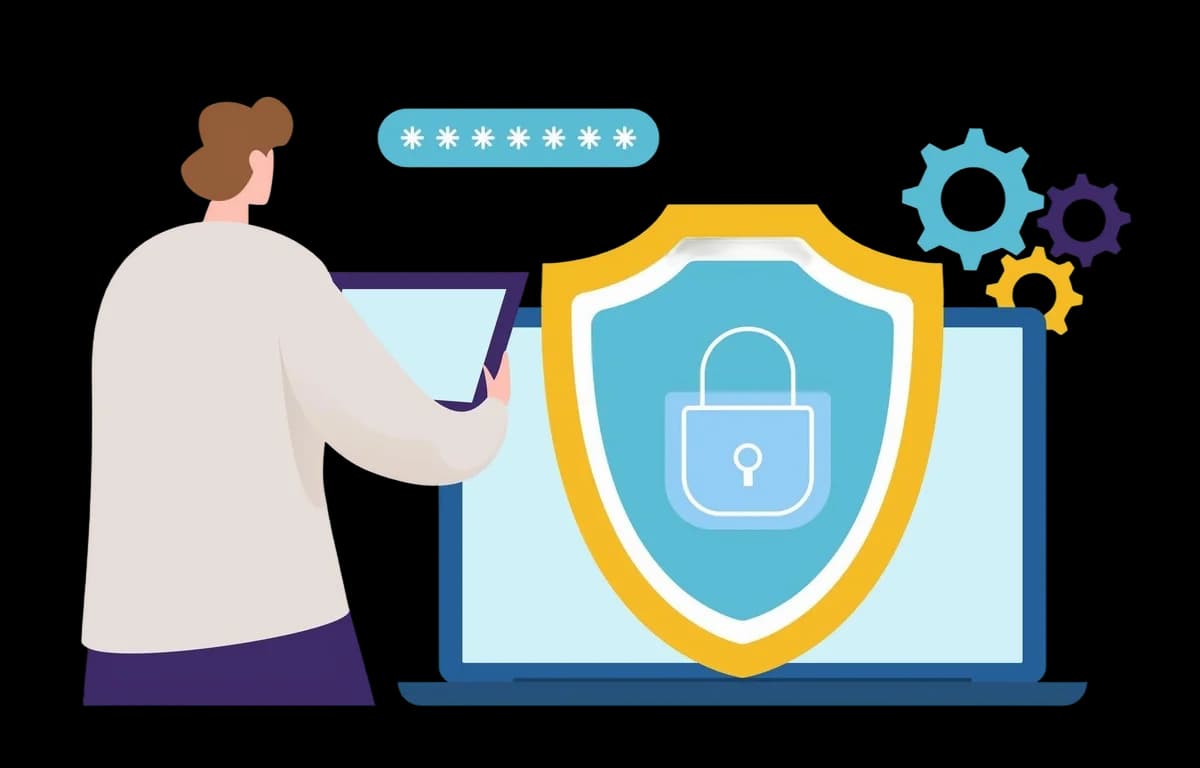 Person securing data on a laptop with a shield and lock icon.