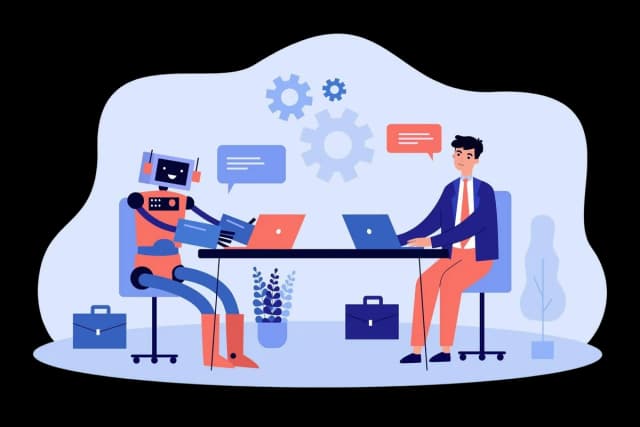 Developer collaborating with an AI assistant at a desk using laptops and shared tools