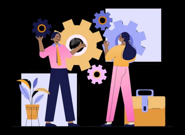 Two coworkers collaborate with large gears, showing teamwork and problem solving in an office setting.