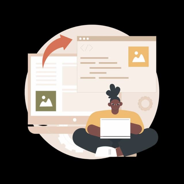 Developer sitting with a laptop, working on code and image files displayed on large screens.