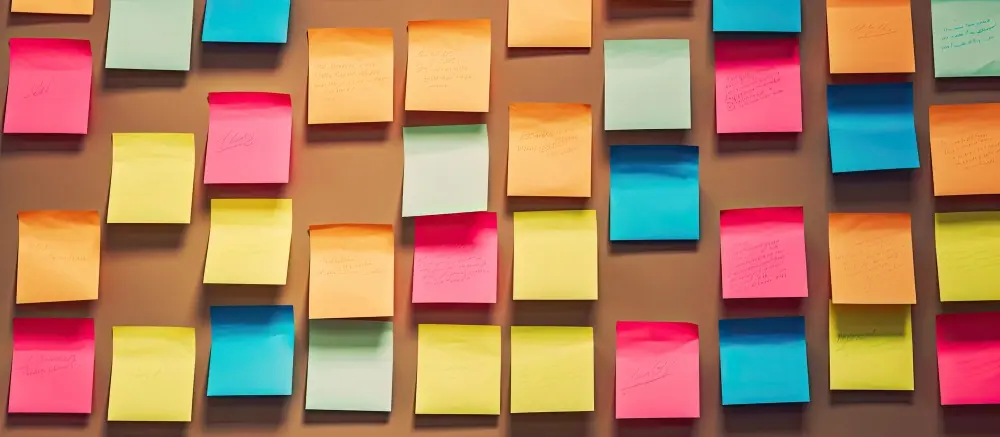 A wall filled with colorful sticky notes as an idea organization concept.